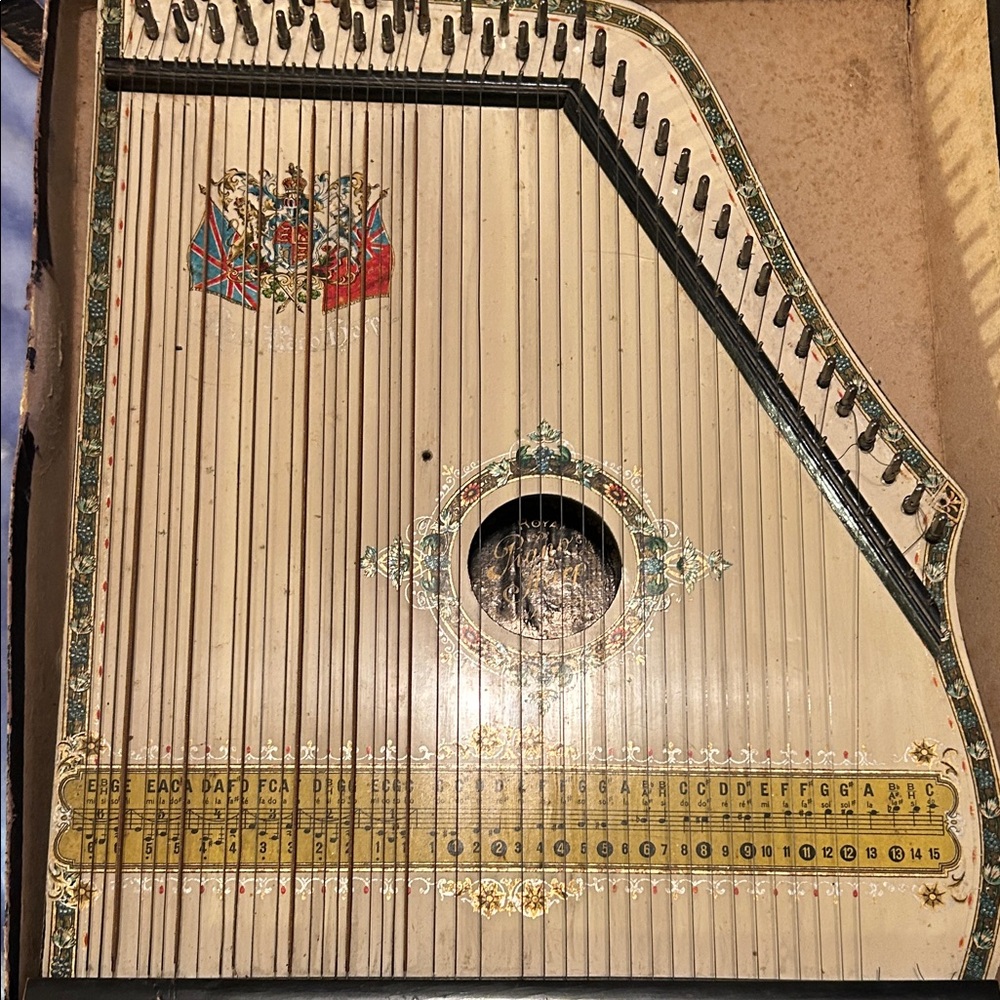 Antique String Instrument with Decorative Crest